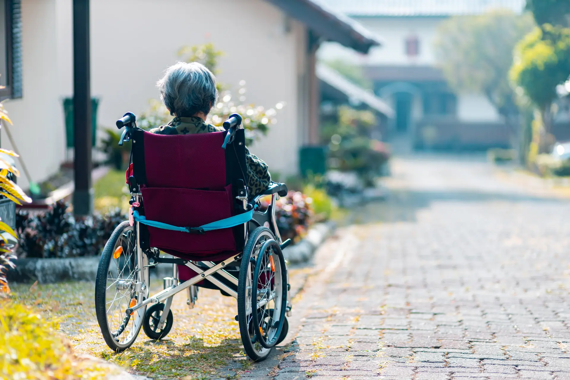 woman in wheelchair sitting outside