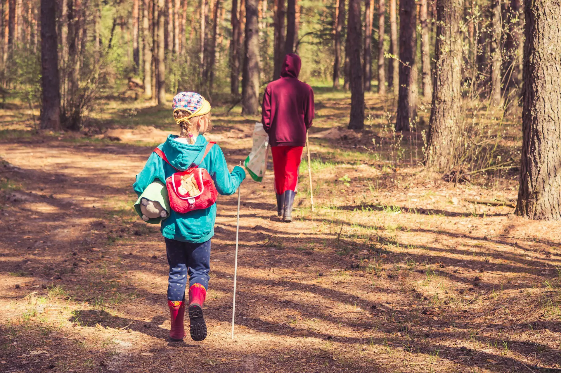 two children hiking through woods