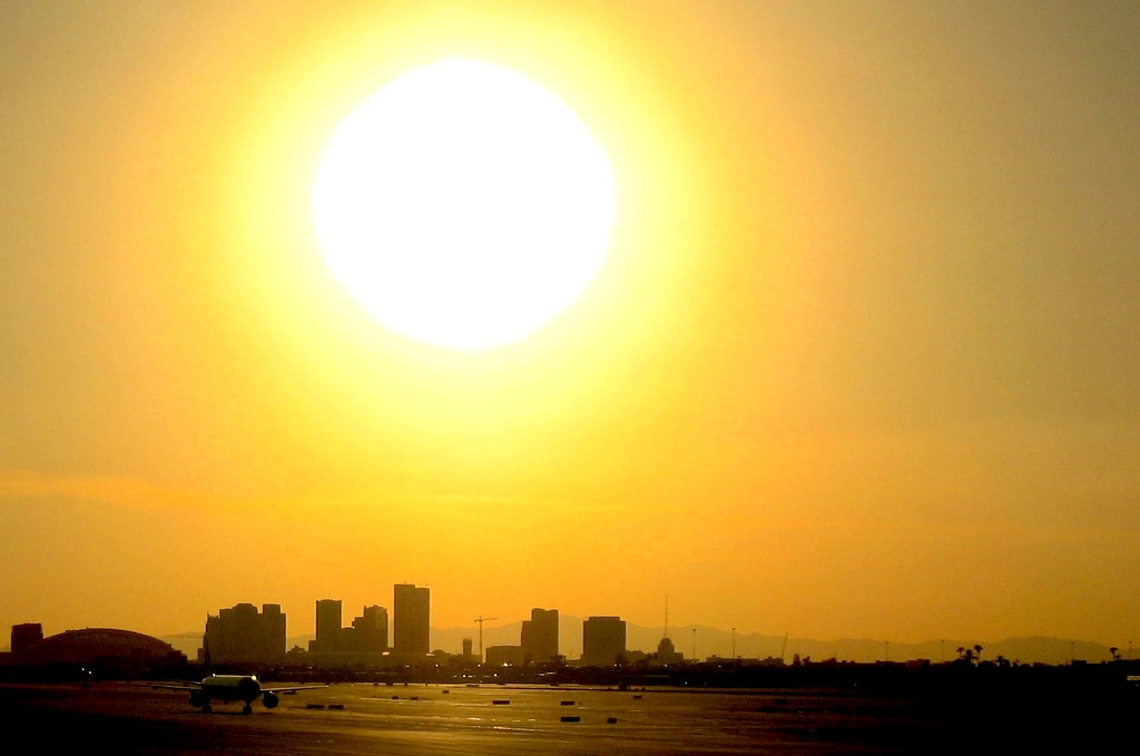 Living will in Phoenix - blinding sun above the city skyline