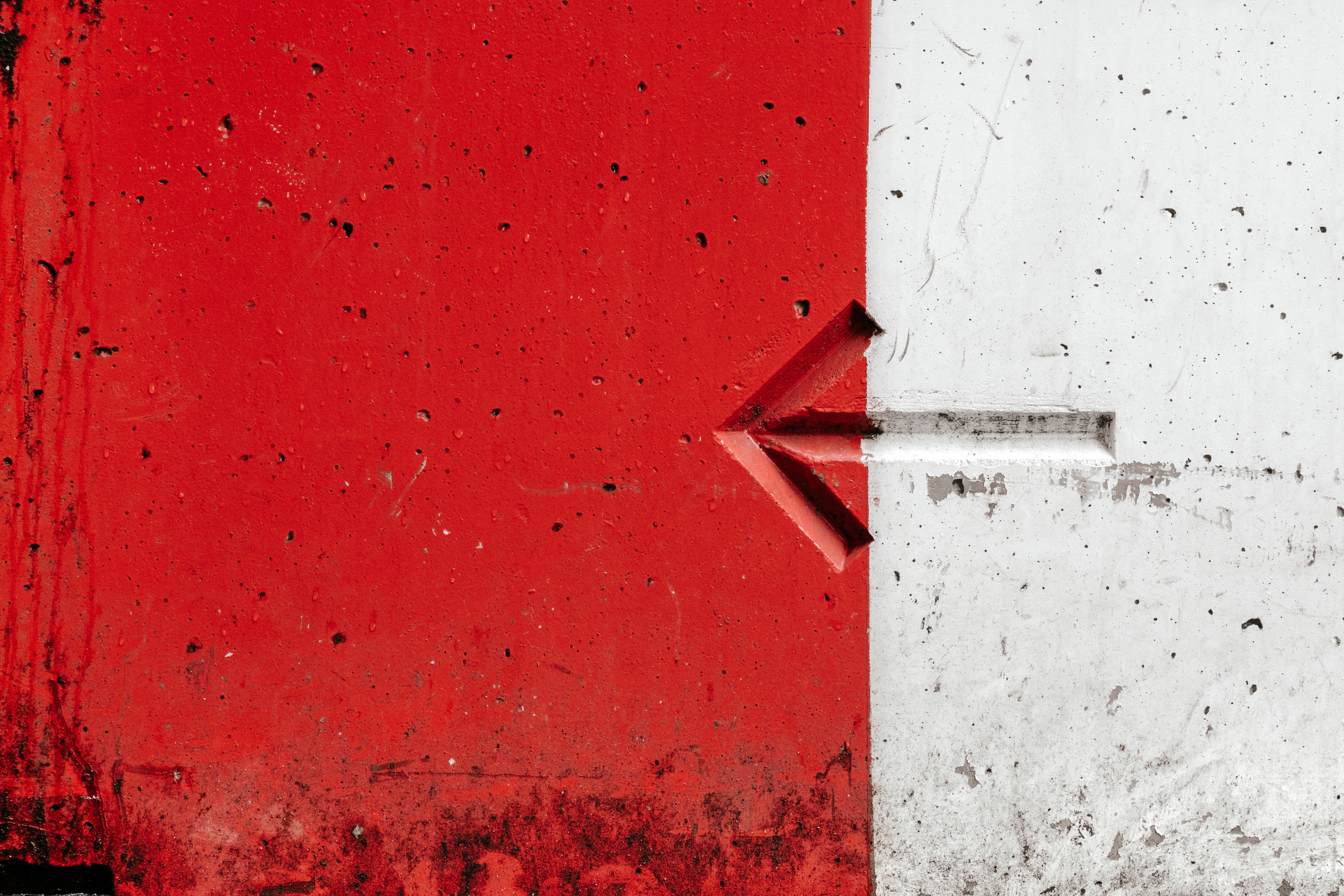 Long-Term Care - arrow embedded in a red and white wall
