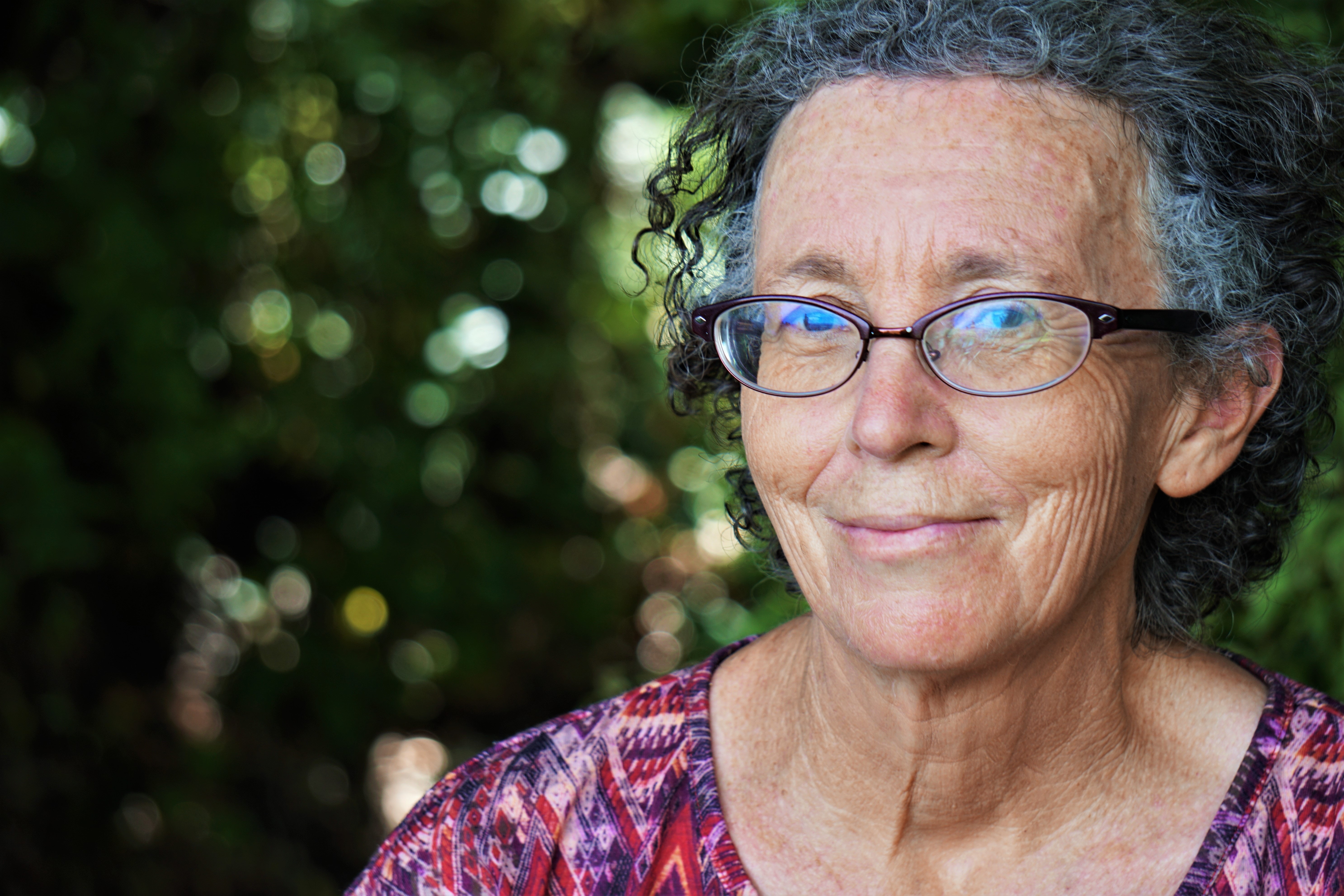 aging successfully - person with glasses smiling
