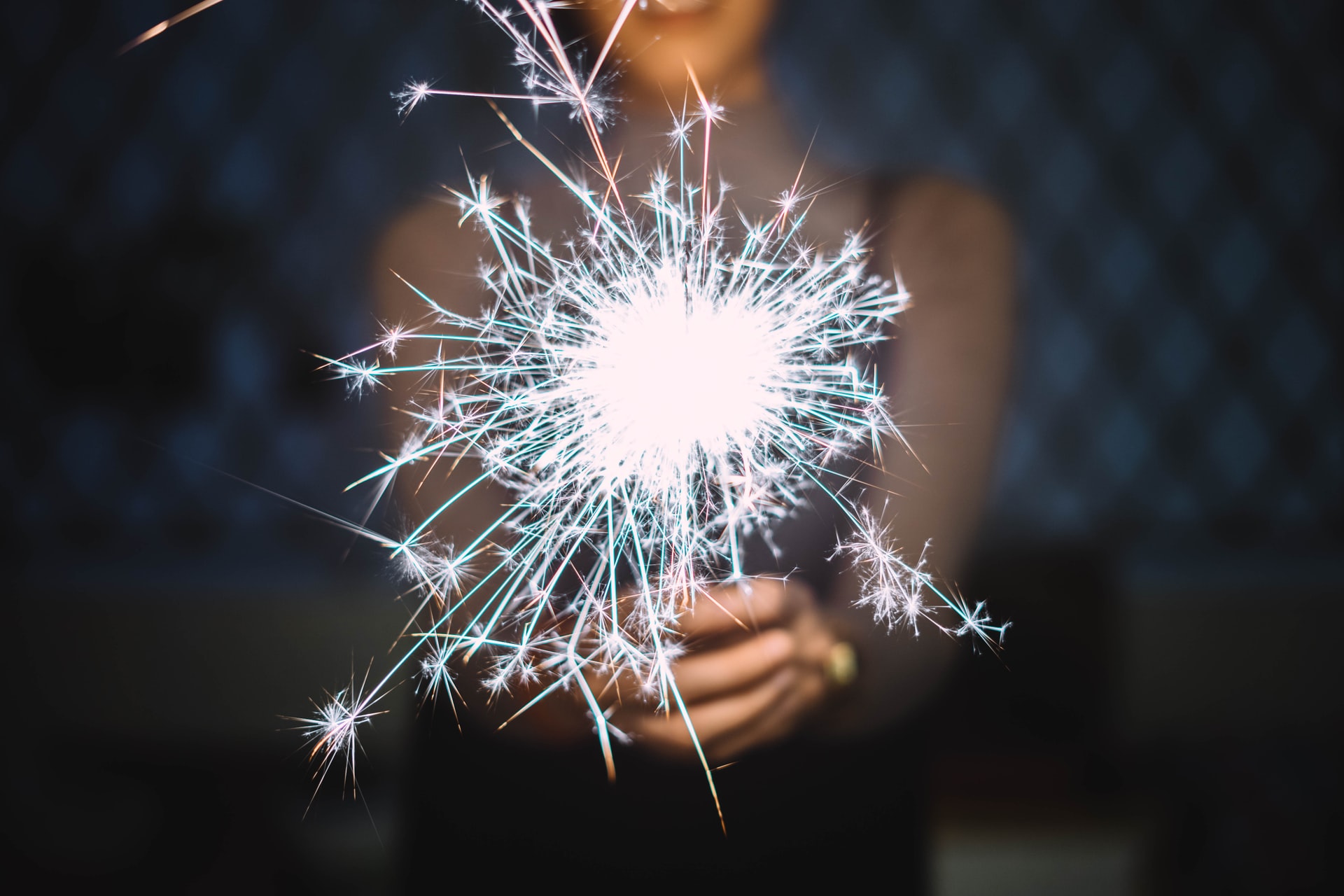 estate planning new year's resolutions - woman holding sparkler