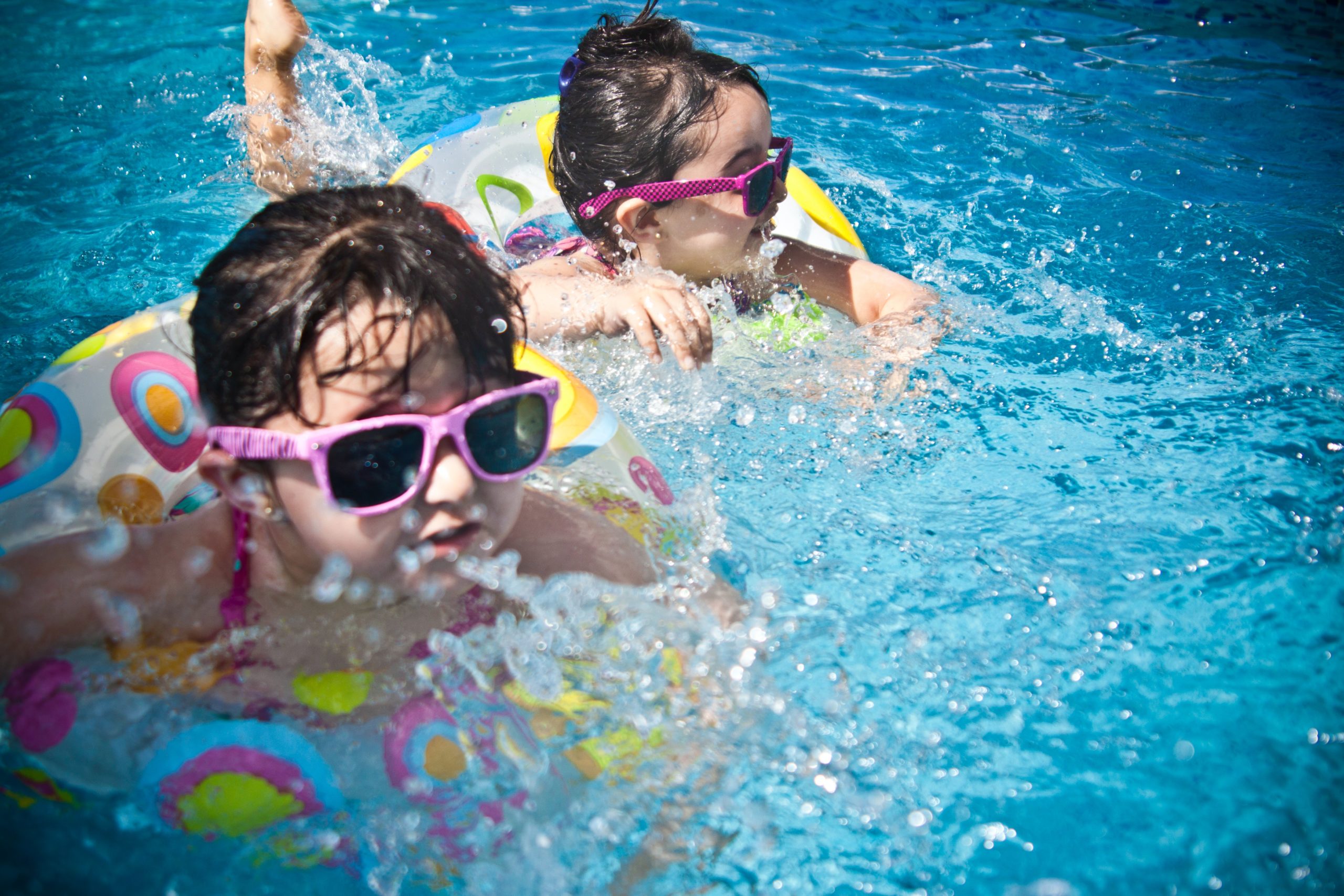 best places to cool off in phoenix -- two kids swimming in a pool