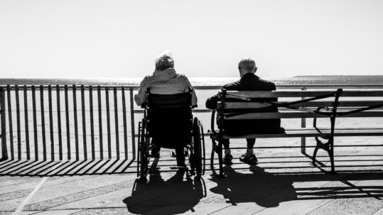 how to change power of attorney - person in wheelchair sitting next to person on bench