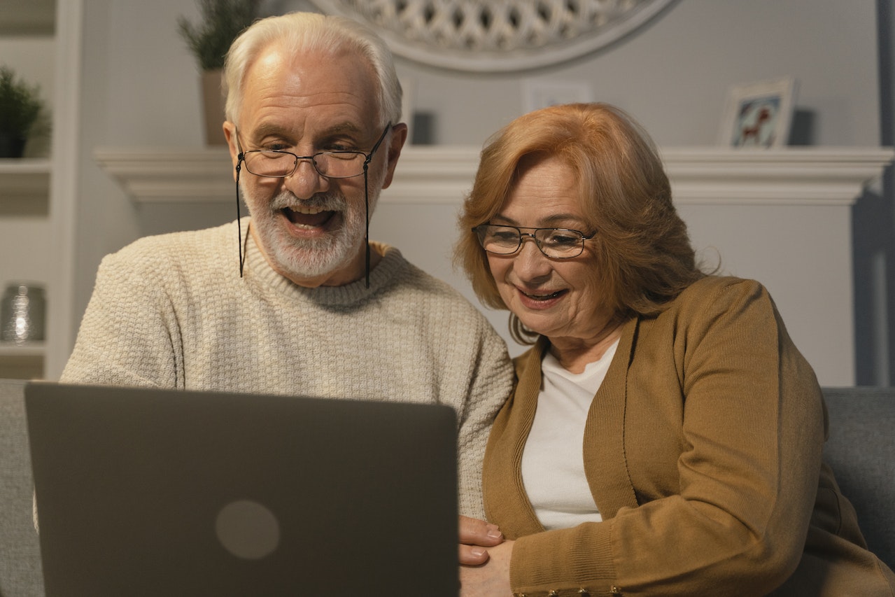 ira contribution age limit - senior couple looking at computer