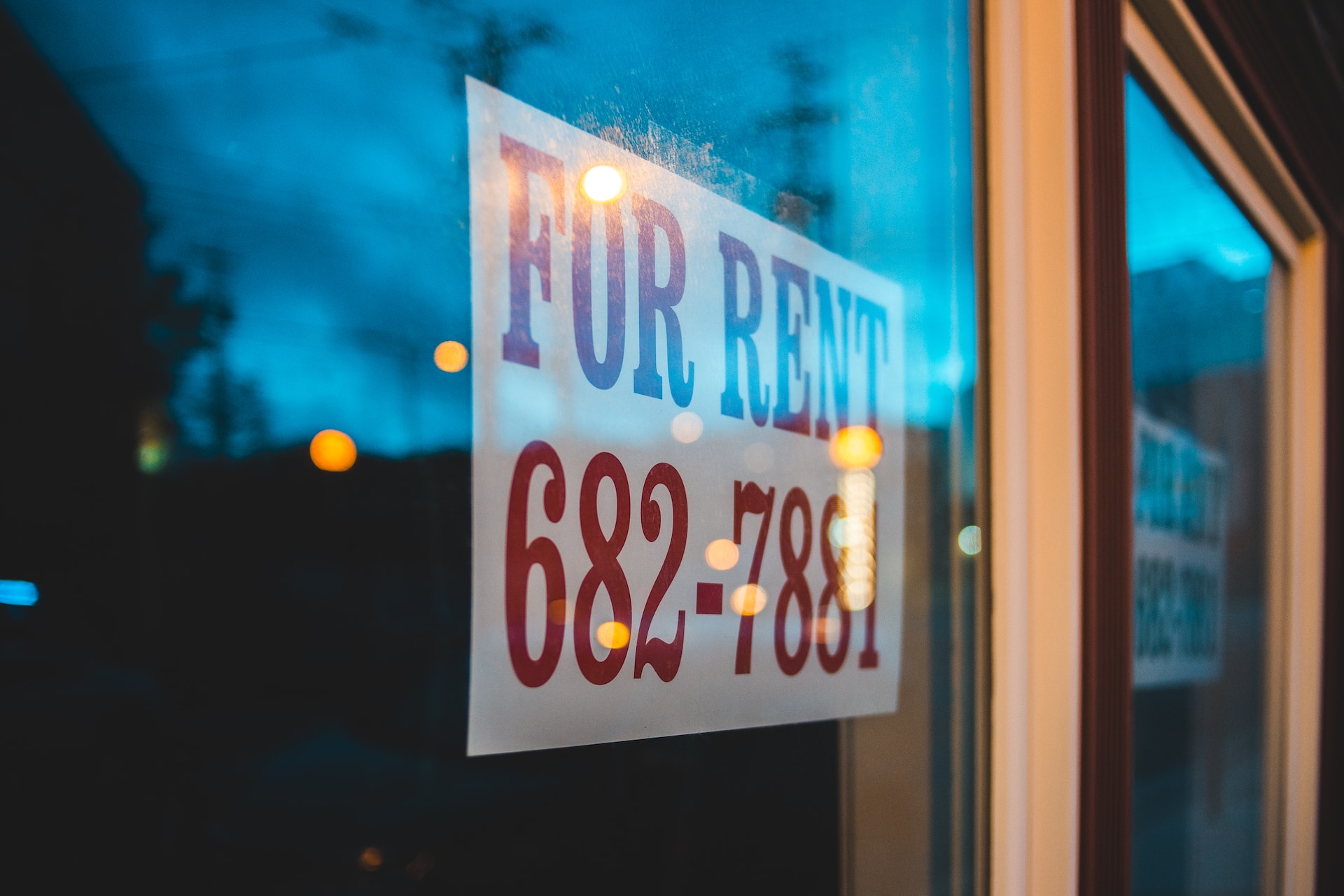 for rent sign hanging in window