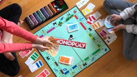 family playing monopoly